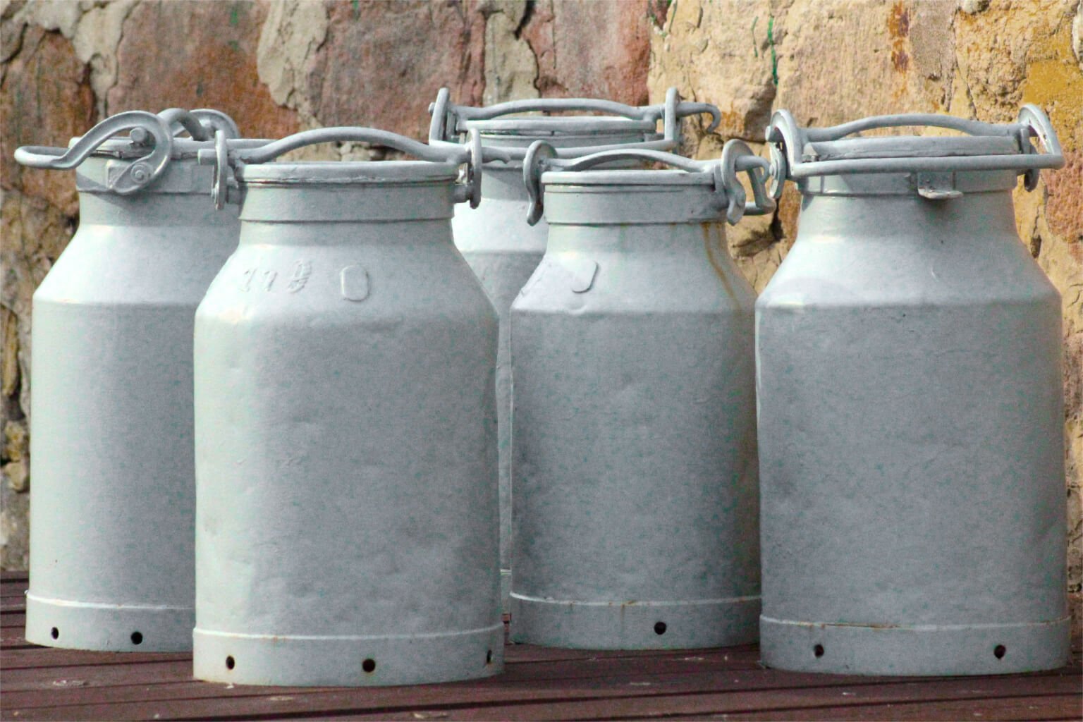 old milk cans lined up