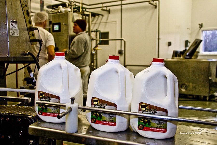 milk jugs at bottling plant