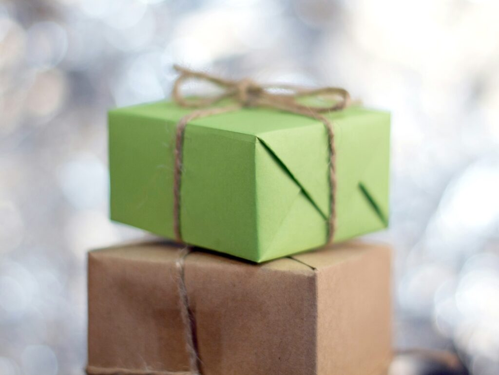 gifts wrapped in construction paper with twine string ribbon